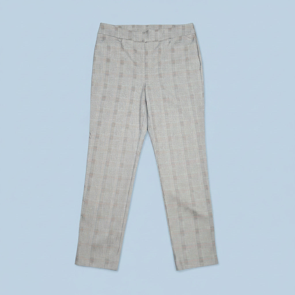 Close-up of checkered fabric with blue, red, and black lines on a beige background
